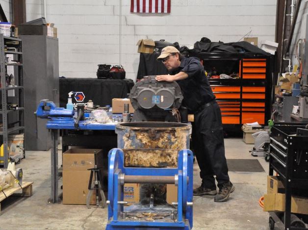 Siewert Equipment Service Supervisor in repair shop, for Albany Business Review article