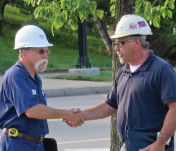 Siewert Service Technician planning pump removal with contractor