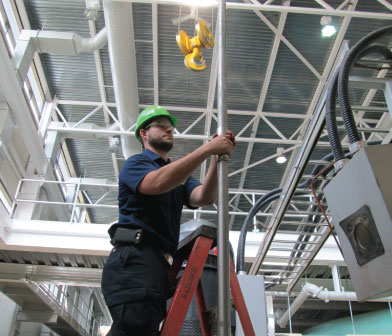 Vertical turbine pump being installed at Cornell University lake water pump station