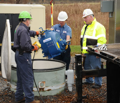 Siewert pump mechanics and Town Superivsor at a below ground Gorman Rupp pump station in Farmington NY