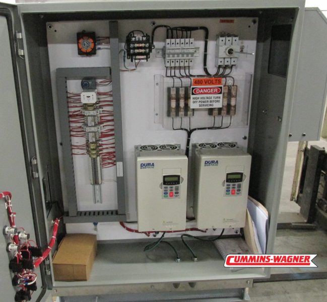 Inside of UL 508A Labeled control panel with flow and pressure monitoring and organized wiring.