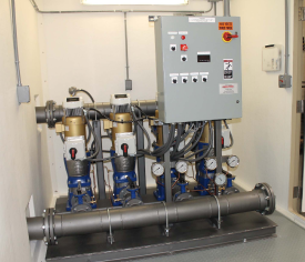 Four Goulds Pumps in fiberglass building with VFD and automatic alternation providing constant pressure to customer.