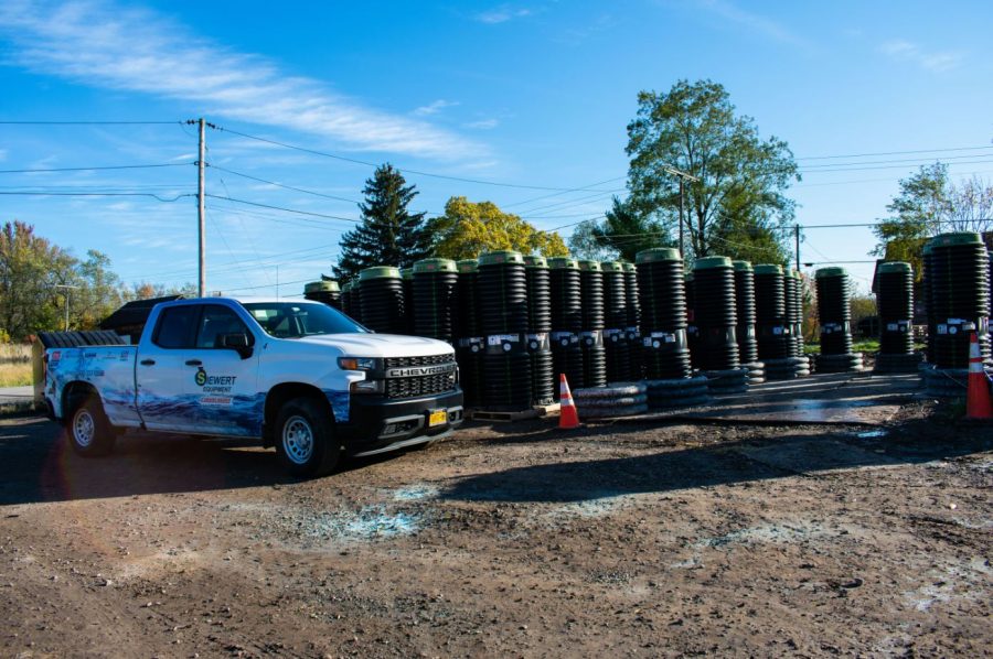 Siewert Equipment service truck by staging area of E/one grinder pumps in Port Bay NY